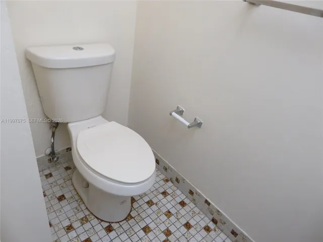 1/2 bathroom at entrance of unit