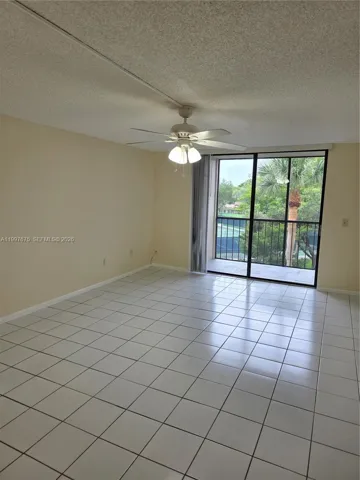 with sliding doors leading to beautiful view of tennias courts