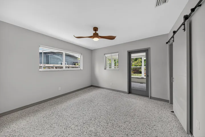 Primary bedroom with door to FL room