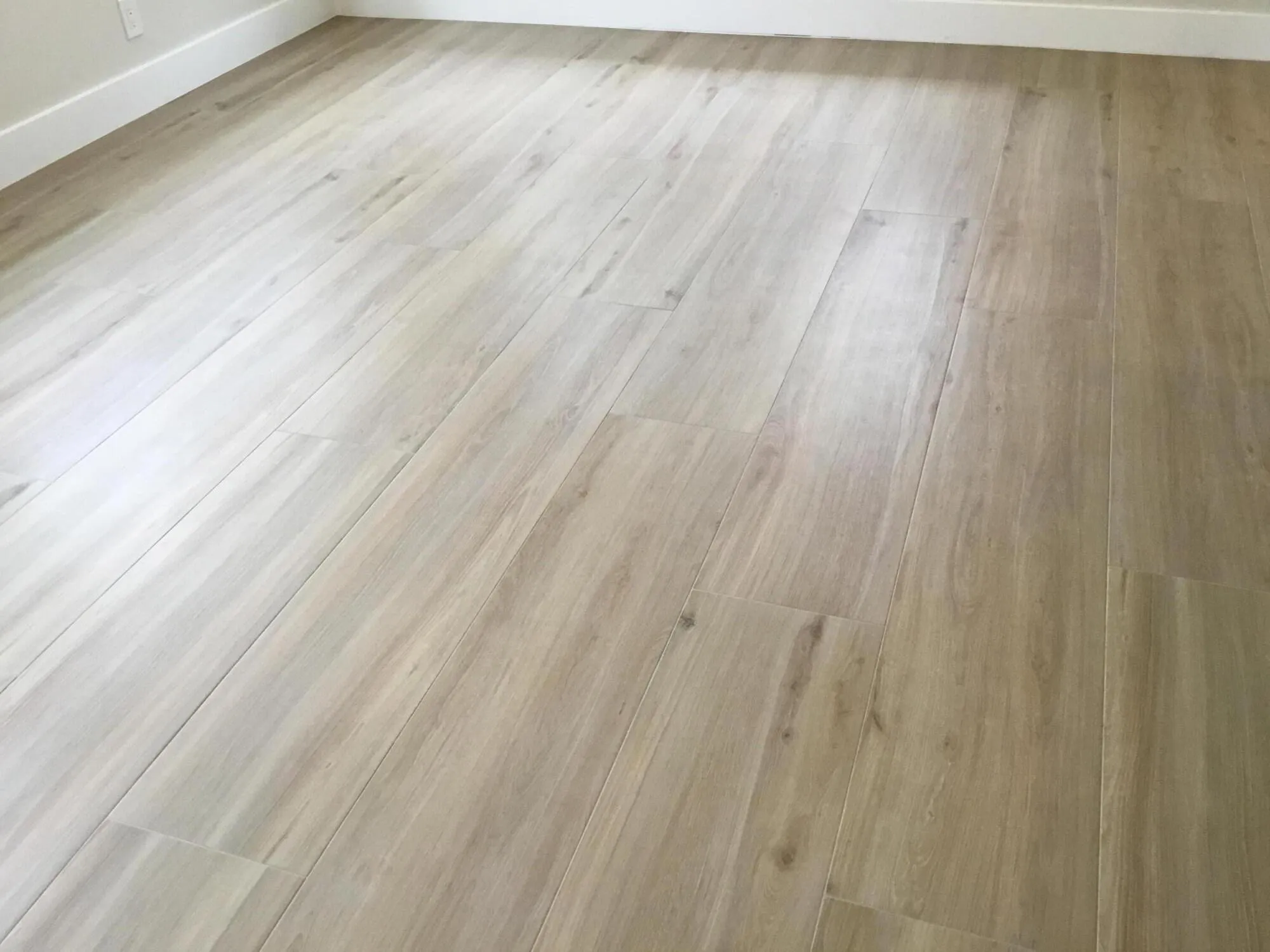 Beautiful New tile floors throughout! Looks like wood but tile planks are easy to clean and very durable.