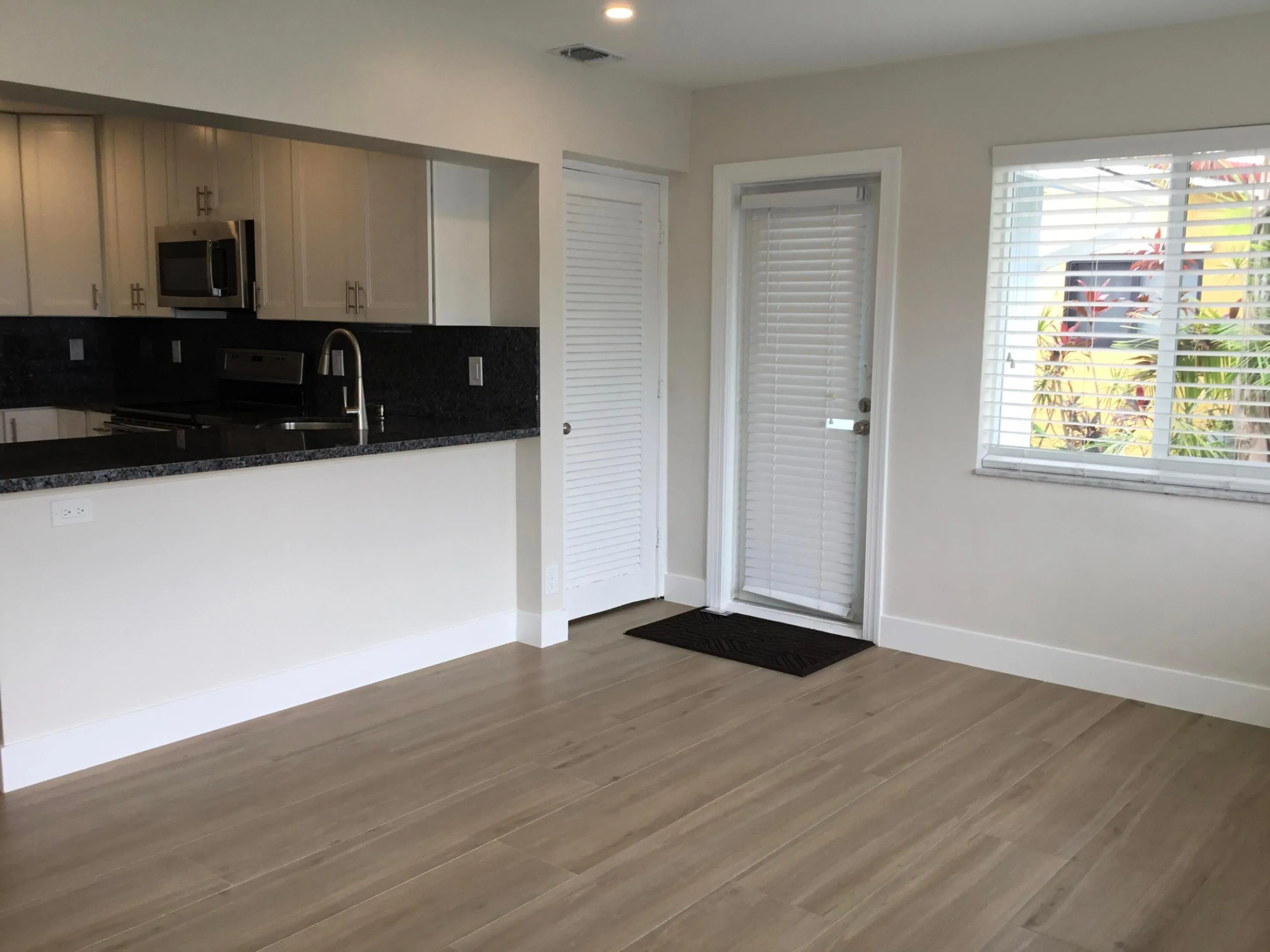 Family room with access to laundry and papered patio