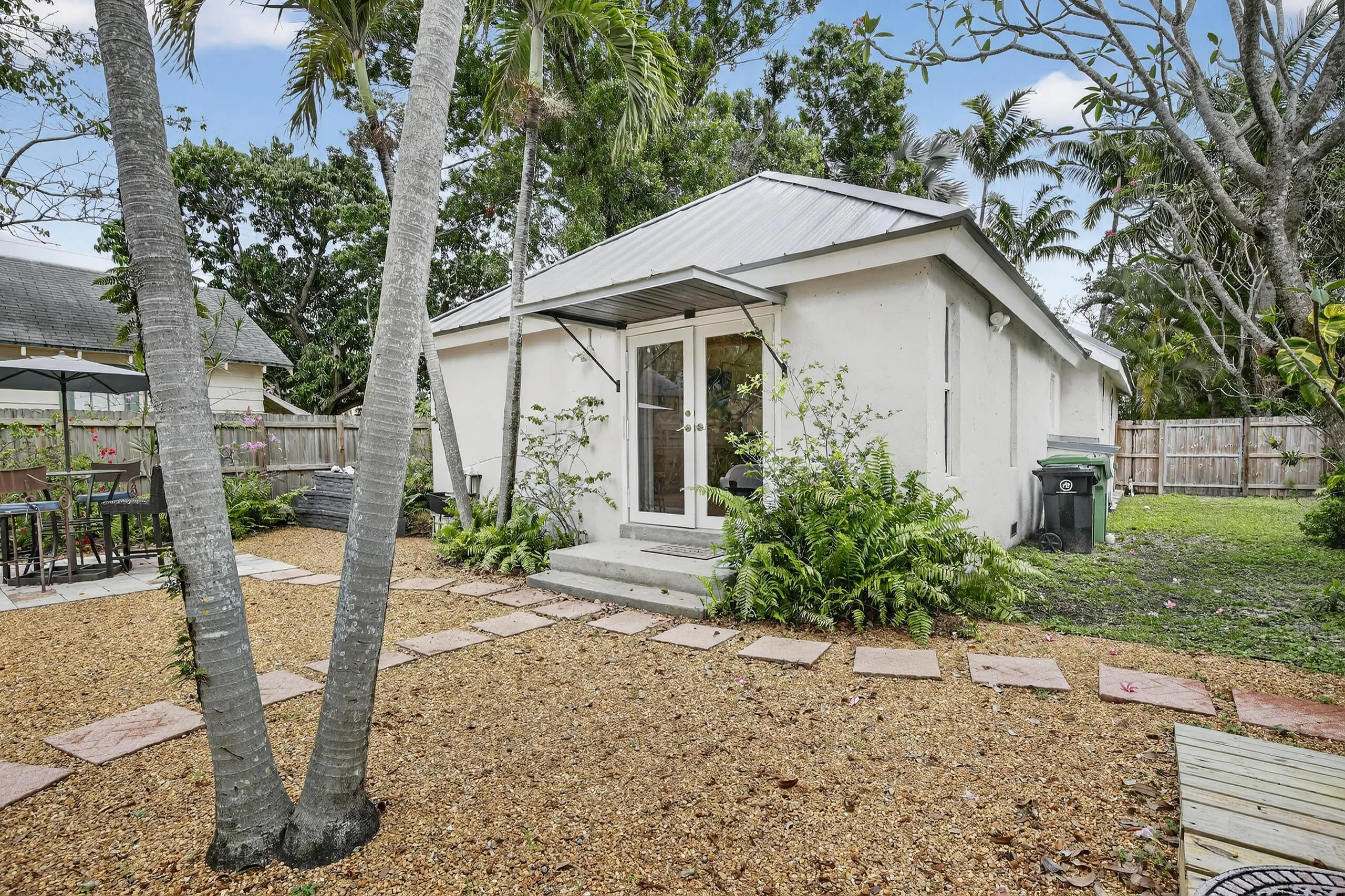backyard with impact French doors to primary bed room