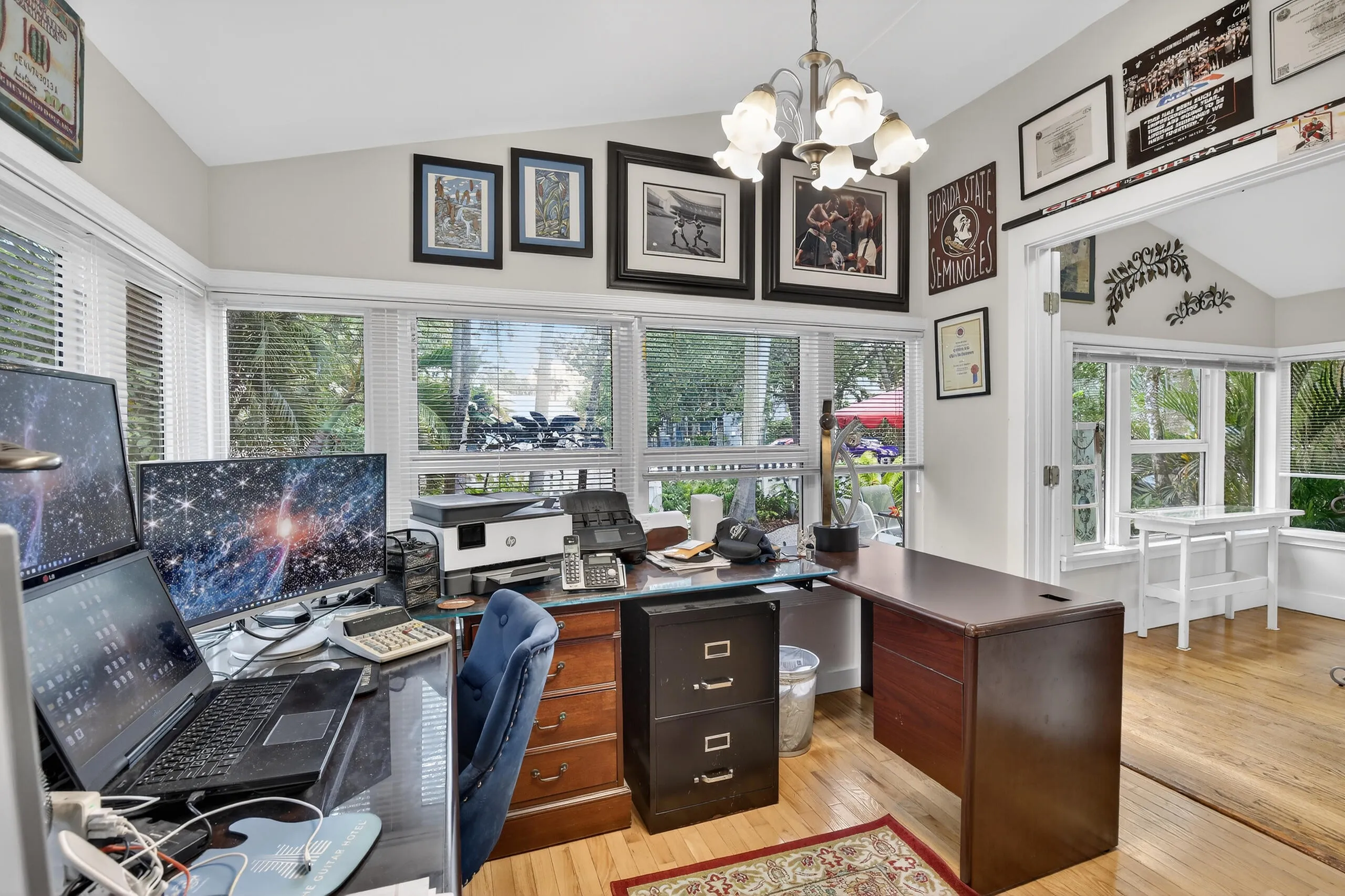 Room to the side serves as office with wrap around windows.