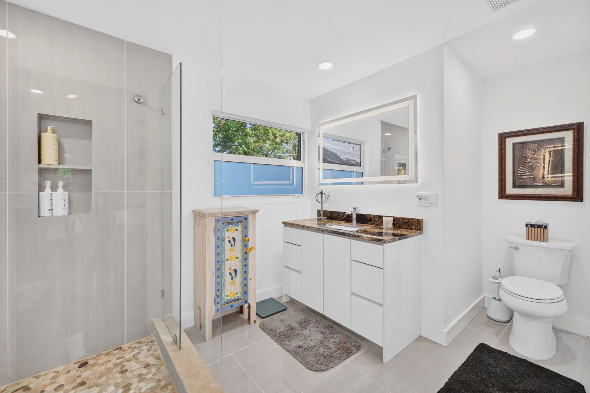 Primarty En-suite Bathroom with double sink & large shower.