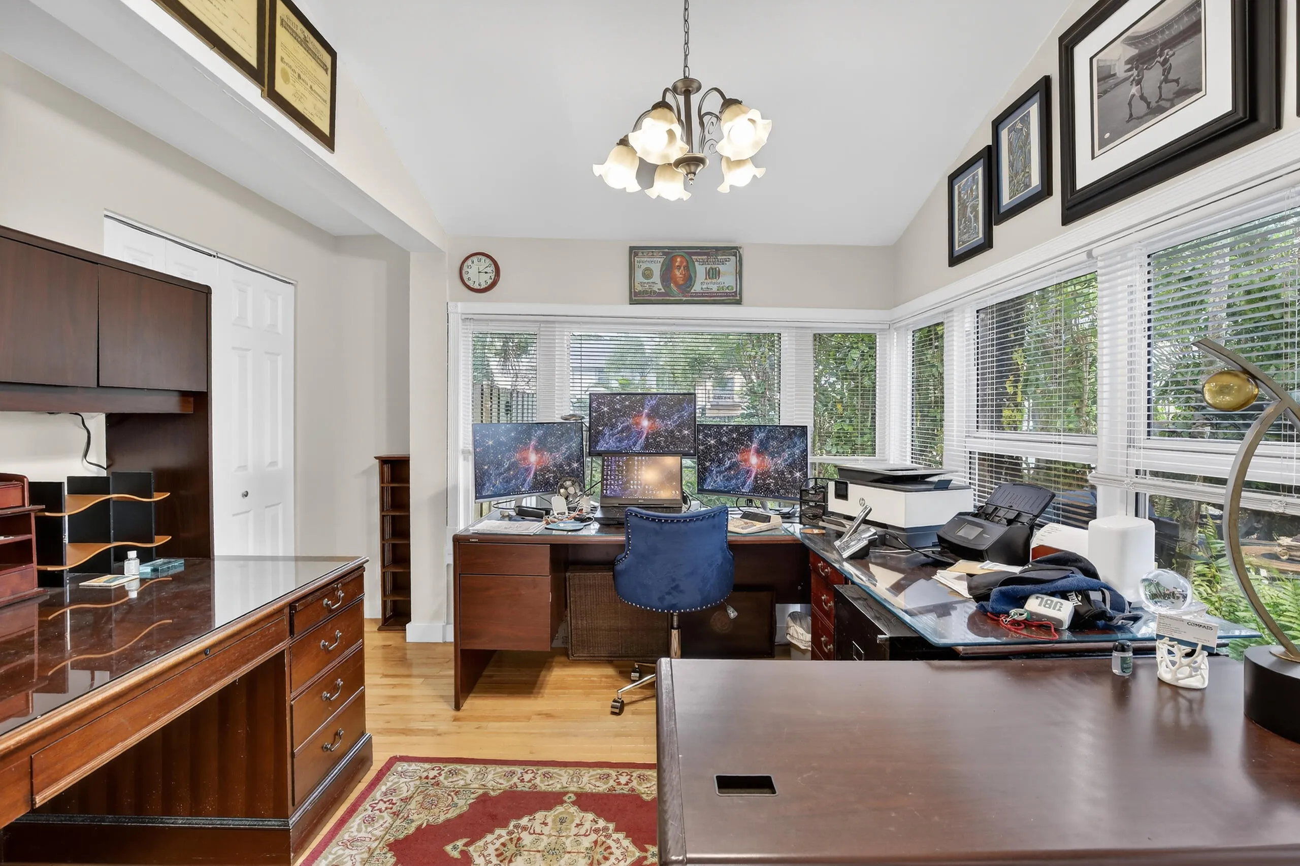 Open side room, used as office space with wrap around windows.