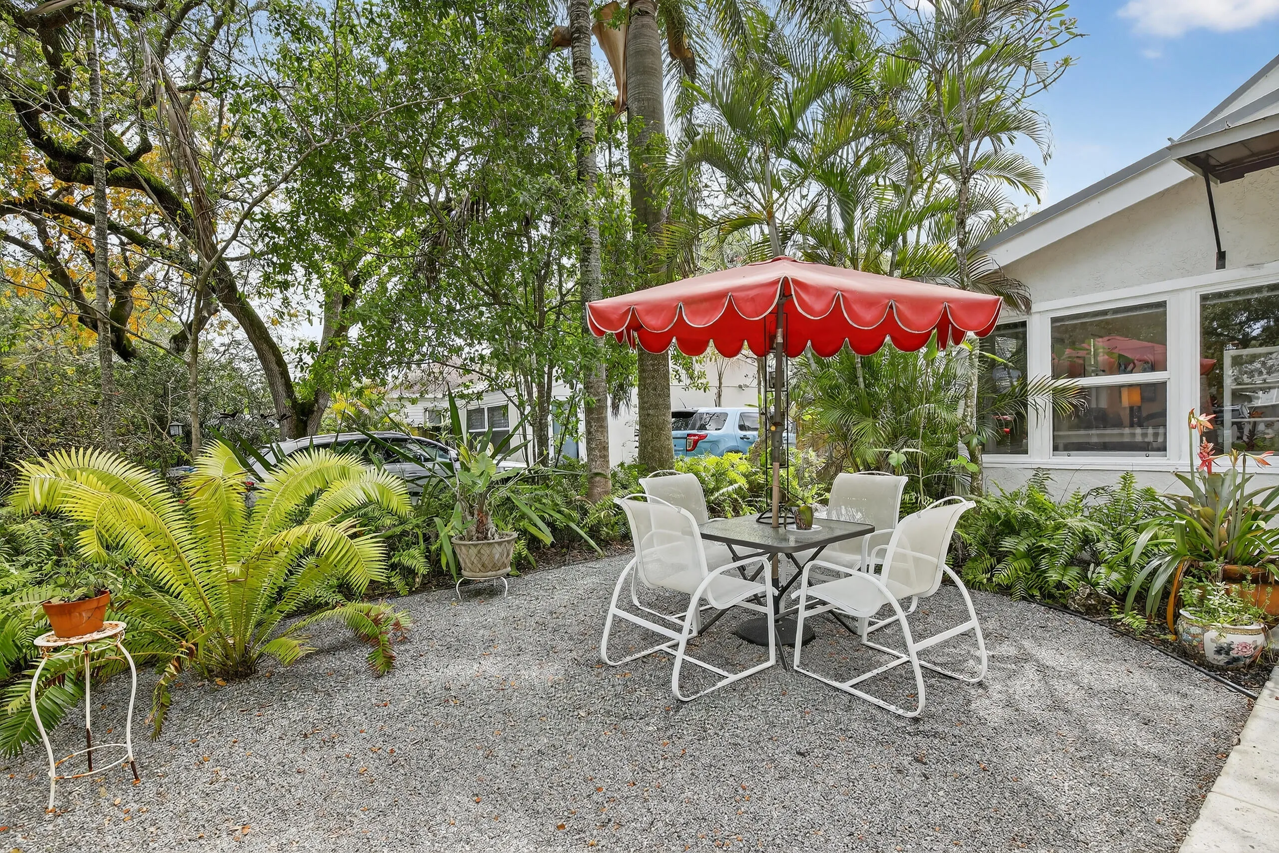 Front yard with several sitting areas.