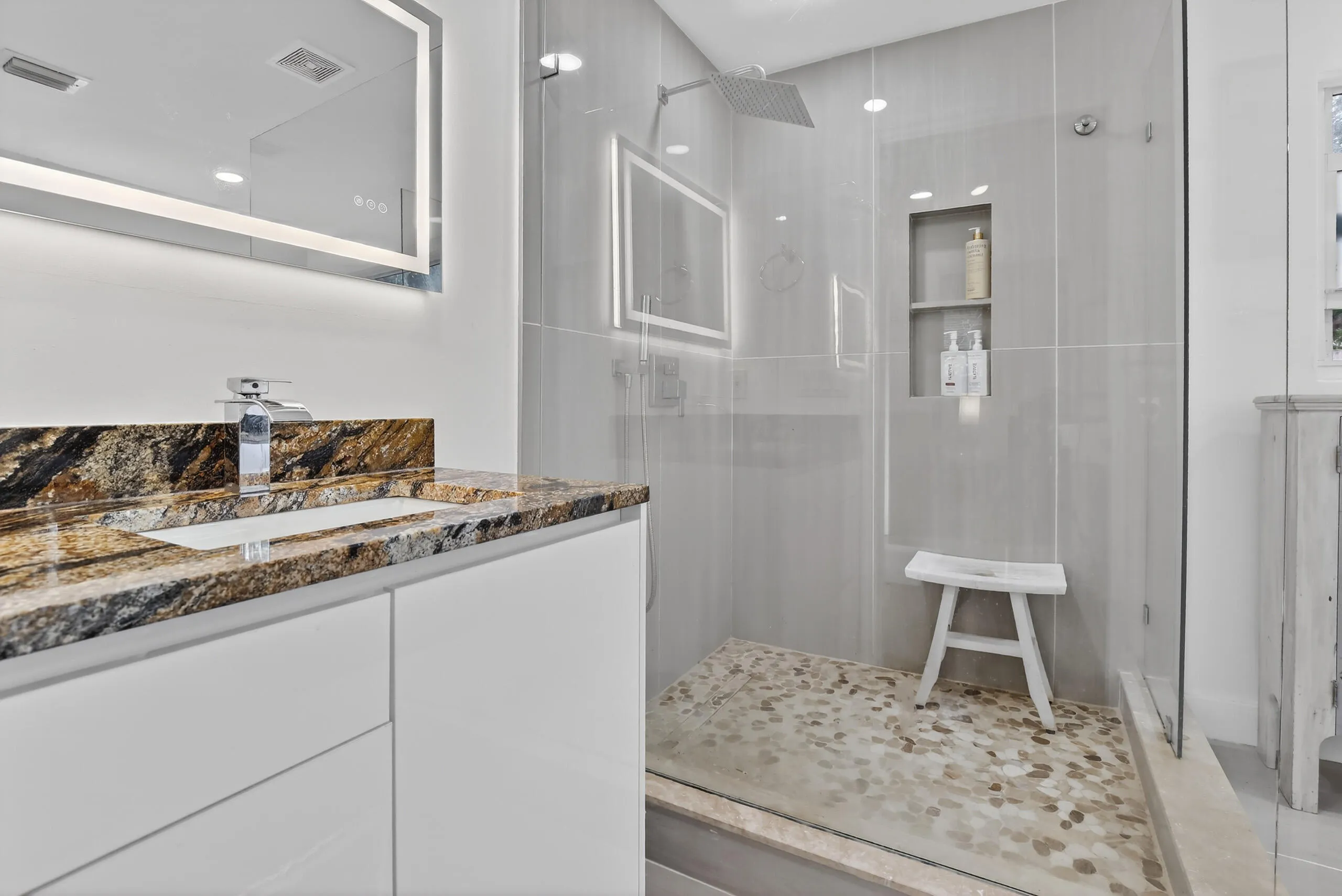 Completely upgraded primary bathroom with double sink and double shower.