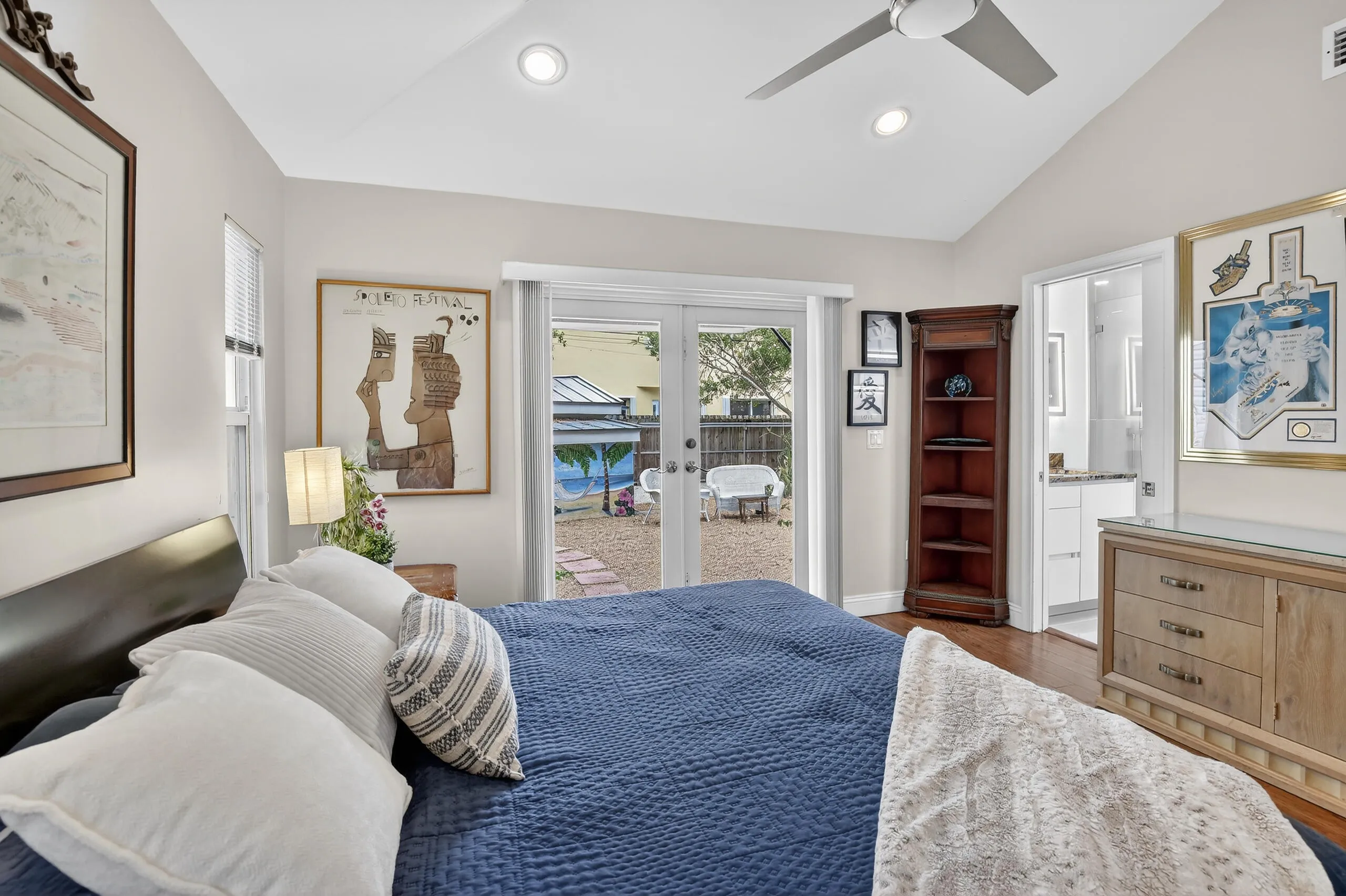 Primary bedroom features vaulted ceilings, deep closet, en-suite bathroom