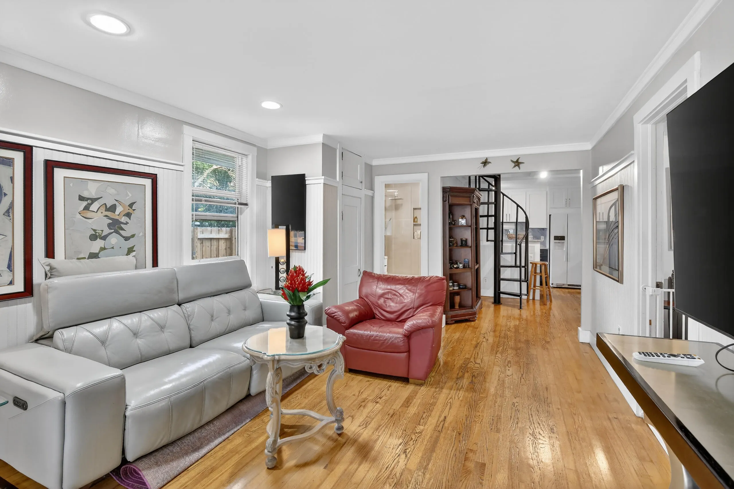 living room with view towards kitchen & guest bathroom door