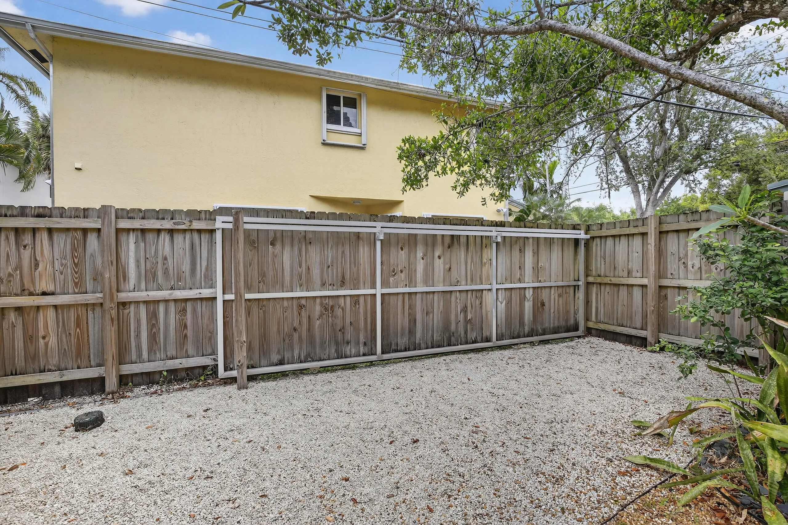 Backyard with entrance from SW 6 Street and alley, space to park car
