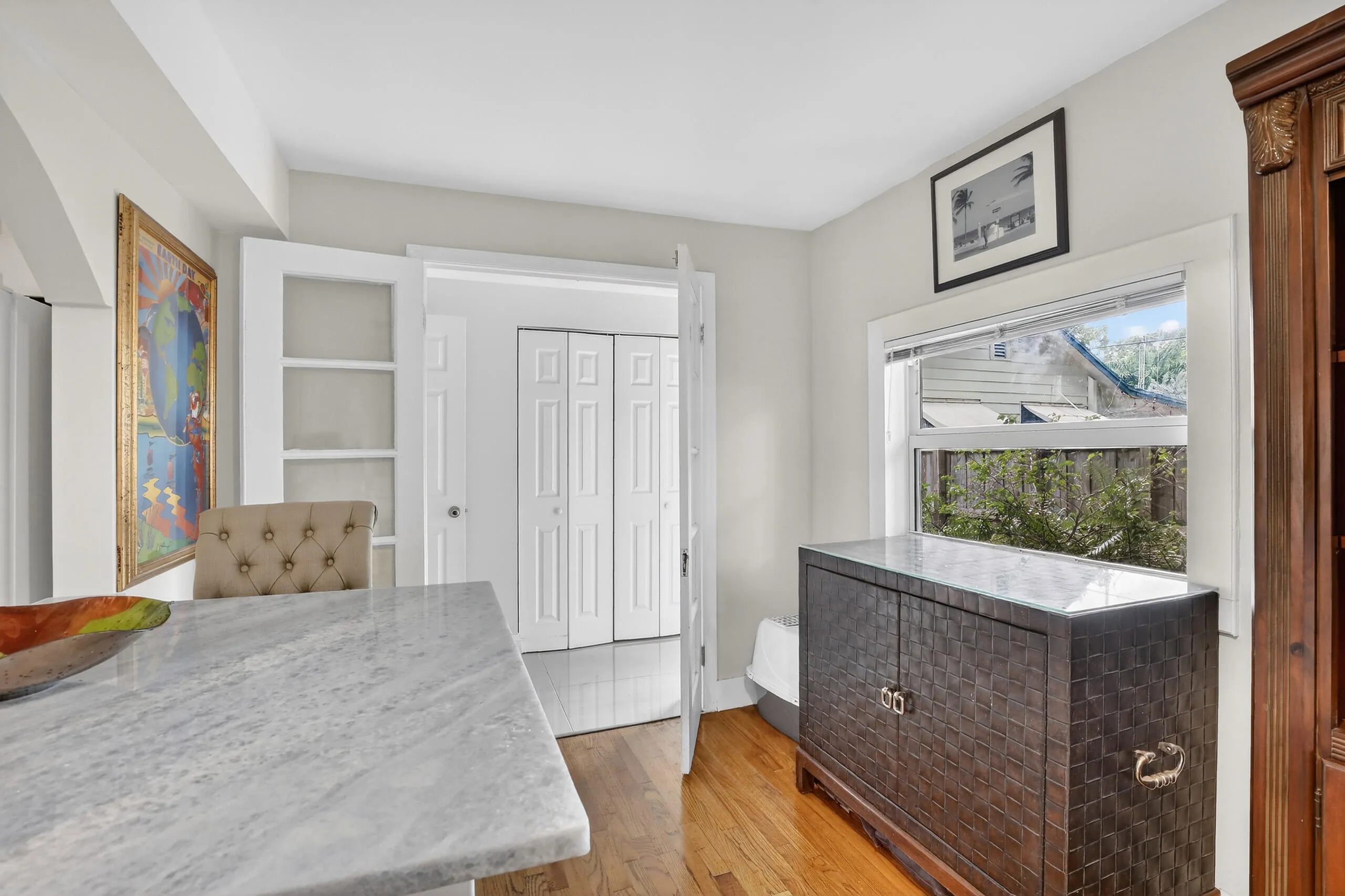 Practical in kitchen dining area with view to laundry closet & hallway