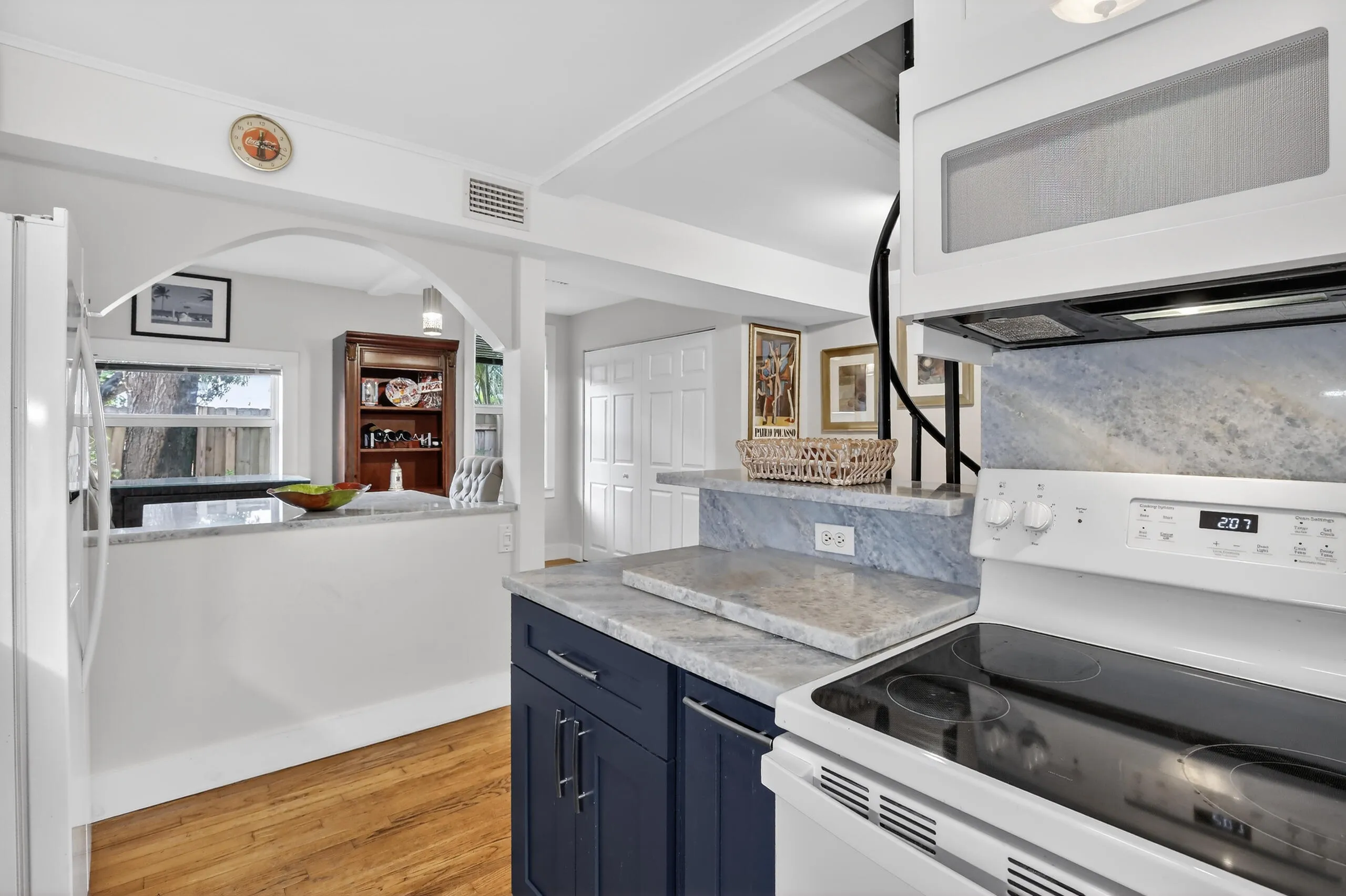 Updated kitchen with quartz counter top, wood cabinets