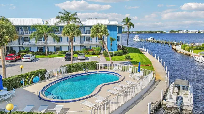 Enjoy true Florida living with three heated pools (this pool is on the south side of the complex, waterfront lounging areas, and boat docks just steps away—perfect for boating, relaxing, and soaking in the coastal lifestyle
