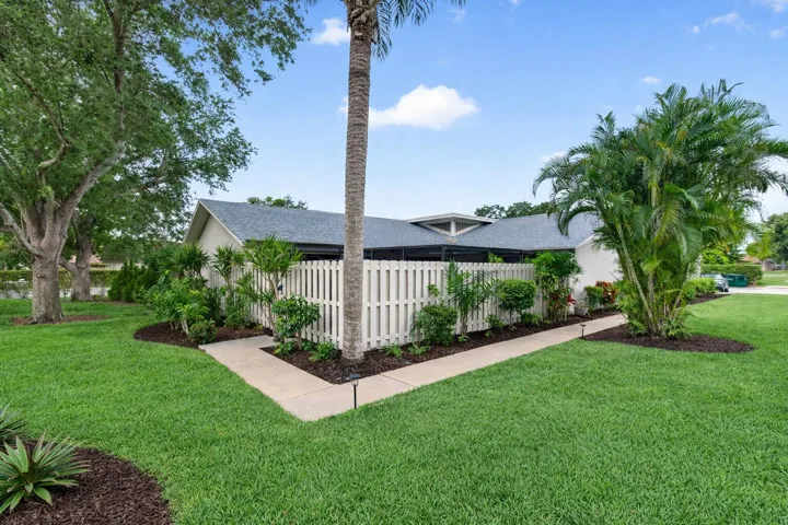 Suburban home with tropical landscaping