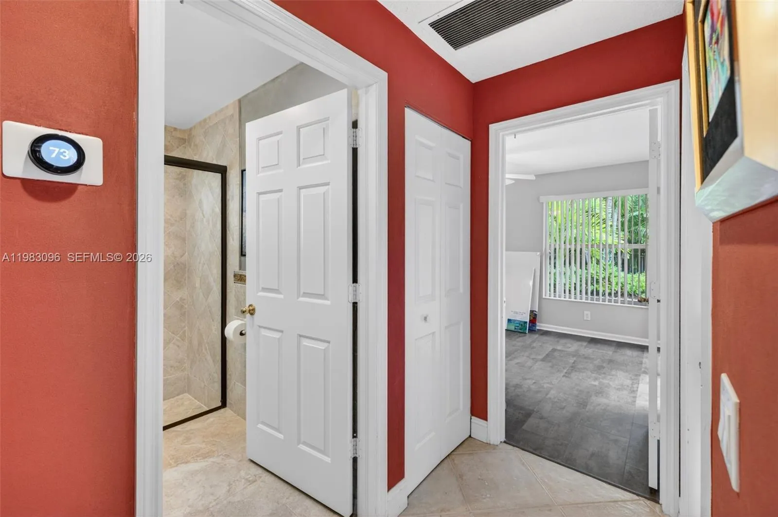 view to guest bedroom toward back of house and bathroom on left view to guest bedroom toward back of house and bathroom on left