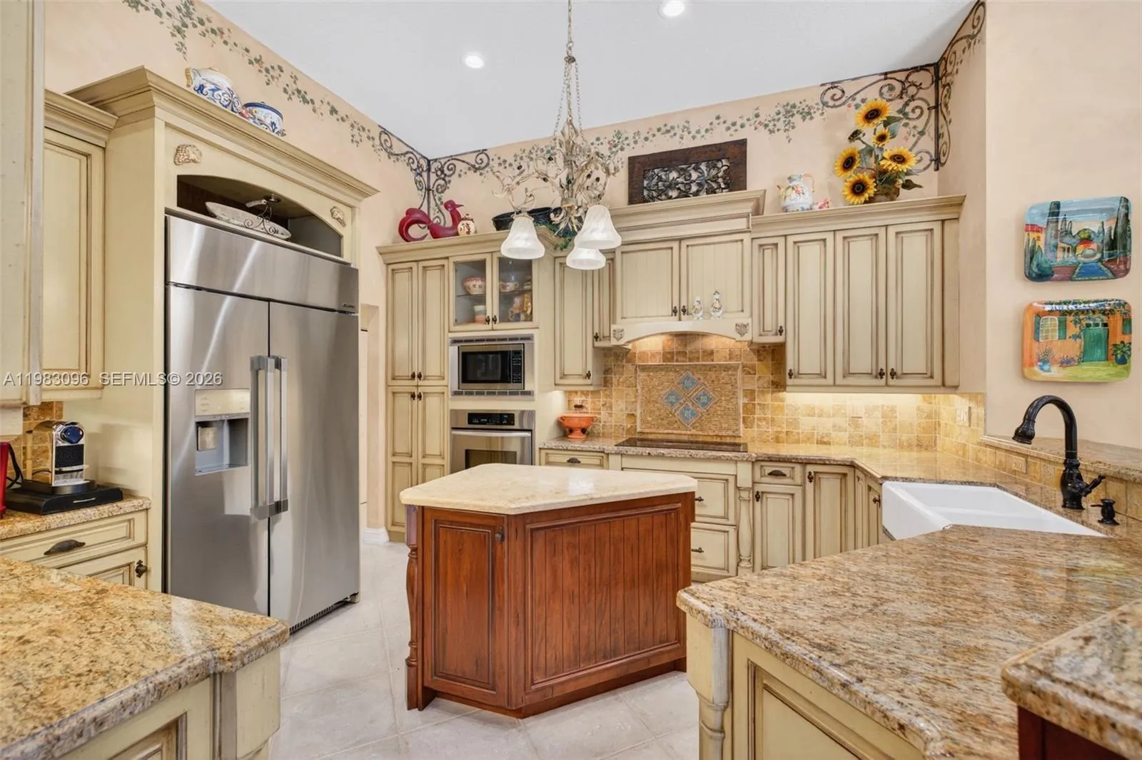 Updated Kitchen w/ premium appliances, cabinets and counters, farmhouse sink, open concept to family room and exquisite lighting Updated Kitchen w/ premium appliances, cabinets and counters, farmhouse sink, open concept to family room and exquisite lighting