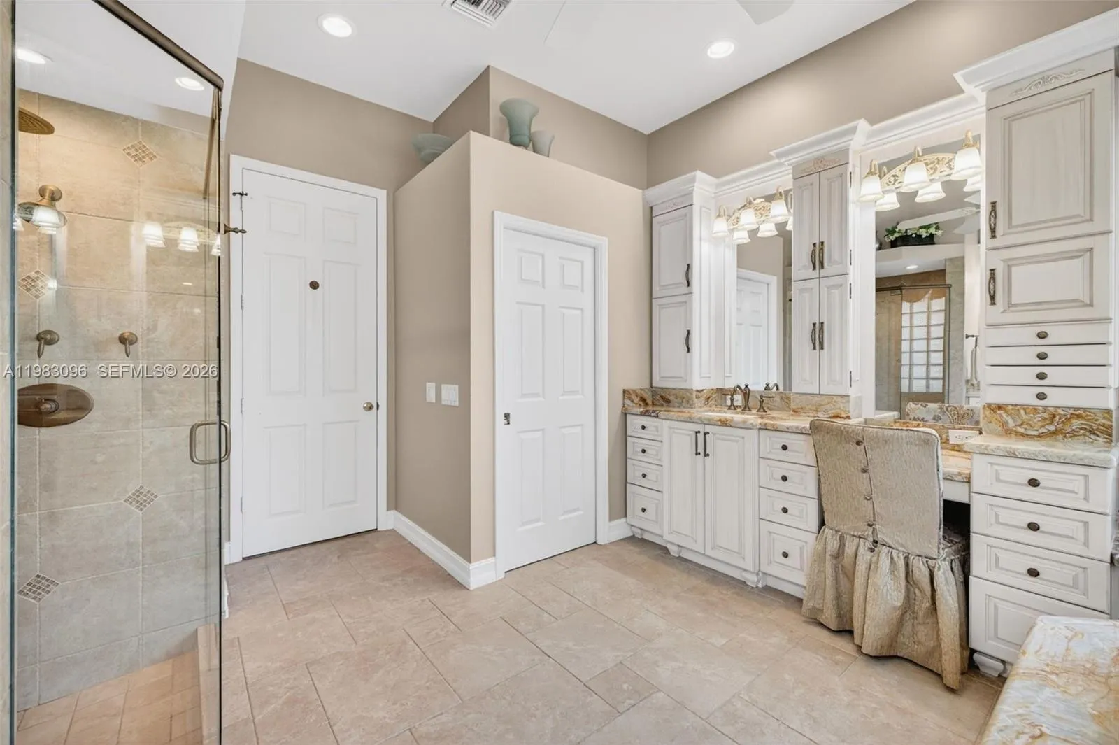 Upgraded primary bathroom w/ jetted tub and separate shower with rain head, plus separate vanities with custom millwork and tons of storage, plus makeup vanity. Water closet room separate Upgraded primary bathroom w/ jetted tub and separate shower with rain head, plus separate vanities with custom millwork and tons of storage, plus makeup vanity. Water closet room separate