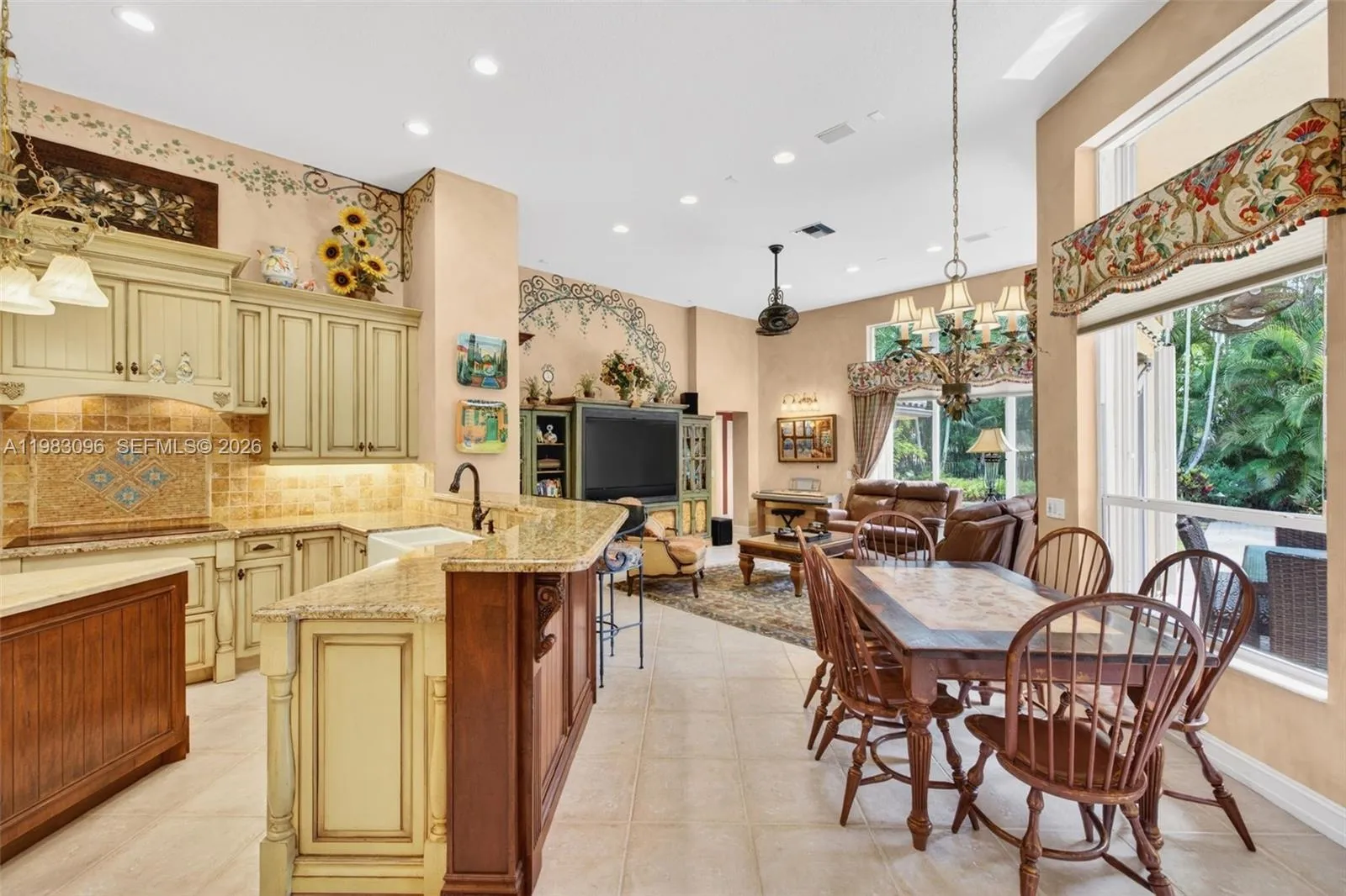 Beautiful handpainted murals and finishes resemble an al fresco restaurant in Europe. Volume Ceilings, Gorgeous painted walls and upgraded wood cabinets, farmhouse sink, high end iron and alabaster fixture in kitchen and another high end fixture over eat in kitchen table. Counter seating and center island in kitchen Beautiful handpainted murals and finishes resemble an al fresco restaurant in Europe. Volume Ceilings, Gorgeous painted walls and upgraded wood cabinets, farmhouse sink, high end iron and alabaster fixture in kitchen and another high end fixture over eat in kitchen table. Counter seating and center island in kitchen