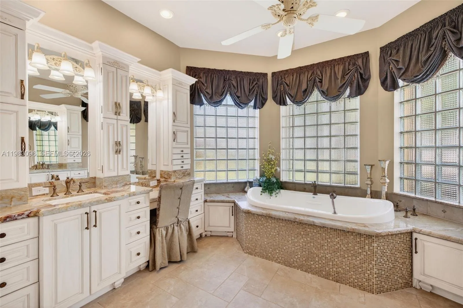 Upgraded primary bathroom w/ jetted tub and separate shower, plus separate vanities with custom millwork and tons of storage, plus makeup vanity. Water closet room separate Upgraded primary bathroom w/ jetted tub and separate shower, plus separate vanities with custom millwork and tons of storage, plus makeup vanity. Water closet room separate