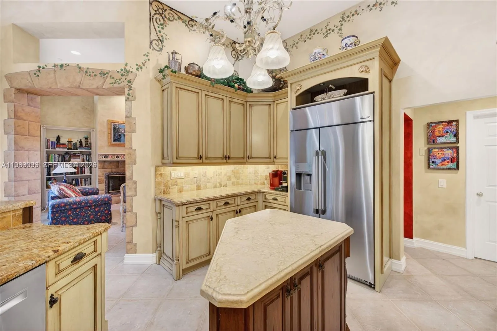 Beautiful handpainted murals and finishes resemble an al fresco restaurant in Europe. Volume Ceilings, Gorgeous painted walls and upgraded wood cabinets, farmhouse sink, high end iron and alabaster fixture in kitchen and another high end fixture over eat in kitchen table. Counter seating and center island in kitchen. Dacor refrigerator, tumbled marble backsplash, built in microwave Beautiful handpainted murals and finishes resemble an al fresco restaurant in Europe. Volume Ceilings, Gorgeous painted walls and upgraded wood cabinets, farmhouse sink, high end iron and alabaster fixture in kitchen and another high end fixture over eat in kitchen table. Counter seating and center island in kitchen. Dacor refrigerator, tumbled marble backsplash, built in microwave