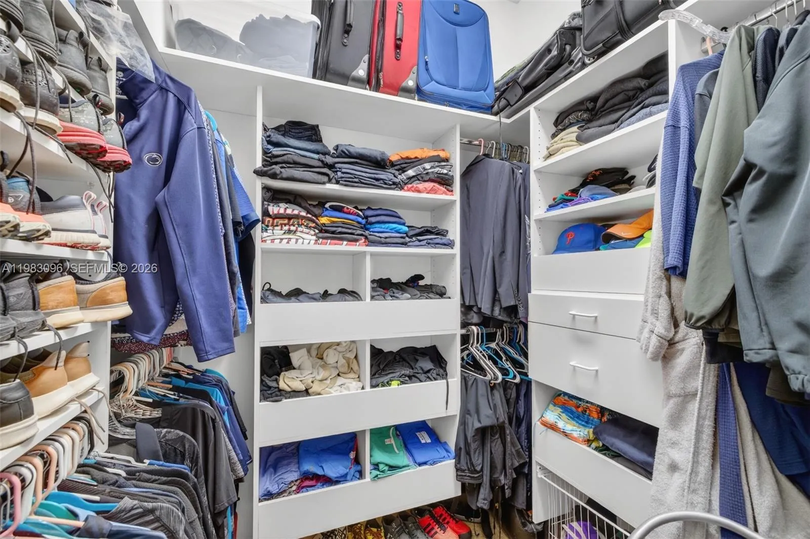 1 of 2 primary bedroom walk in closets 1 of 2 primary bedroom walk in closets