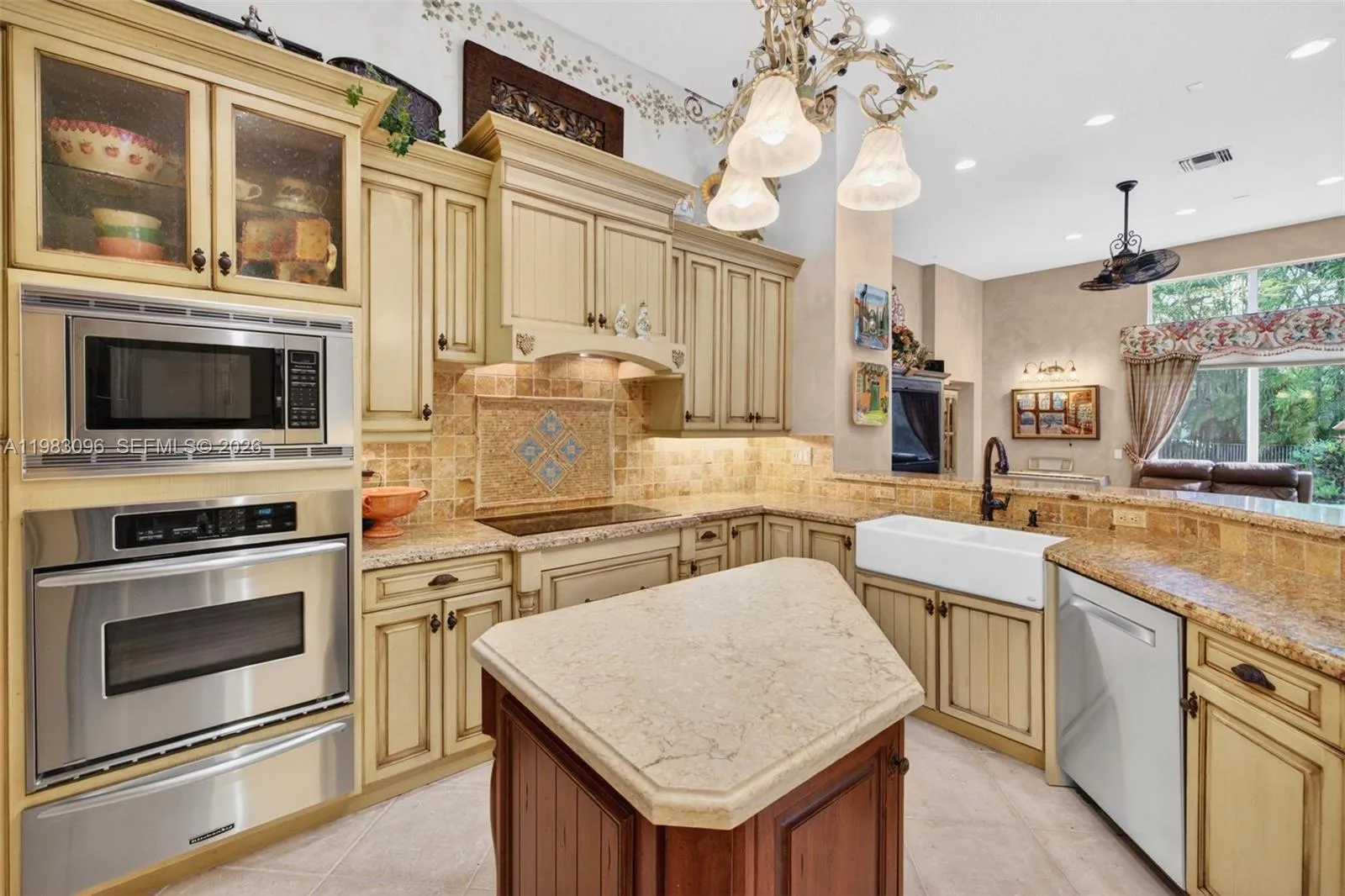 Beautiful handpainted murals and finishes resemble an al fresco restaurant in Europe. Volume Ceilings, Gorgeous painted walls and upgraded wood cabinets, farmhouse sink, high end iron and alabaster fixture in kitchen and another high end fixture over eat in kitchen table. Counter seating and center island in kitchen. Dacor refrigerator, tumbled marble backsplash, built in microwave and warming drawer Beautiful handpainted murals and finishes resemble an al fresco restaurant in Europe. Volume Ceilings, Gorgeous painted walls and upgraded wood cabinets, farmhouse sink, high end iron and alabaster fixture in kitchen and another high end fixture over eat in kitchen table. Counter seating and center island in kitchen. Dacor refrigerator, tumbled marble backsplash, built in microwave and warming drawer