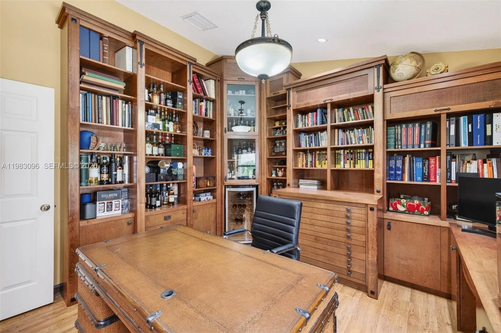 Bedroom converted to an office w/ custom millwork, built in wood cabinets with storage, filing cabinets and beverage cooler Bedroom converted to an office w/ custom millwork, built in wood cabinets with storage, filing cabinets and beverage cooler