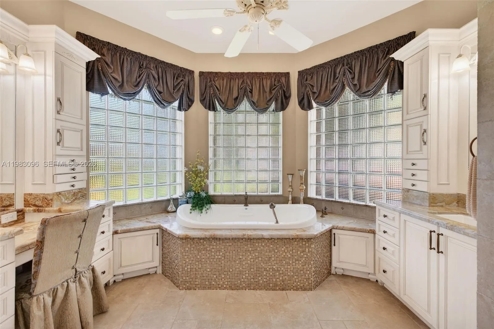 Upgraded primary bathroom w/ jetted tub and separate shower, plus separate vanities with custom millwork and tons of storage, plus makeup vanity. Water closet room separate Upgraded primary bathroom w/ jetted tub and separate shower, plus separate vanities with custom millwork and tons of storage, plus makeup vanity. Water closet room separate