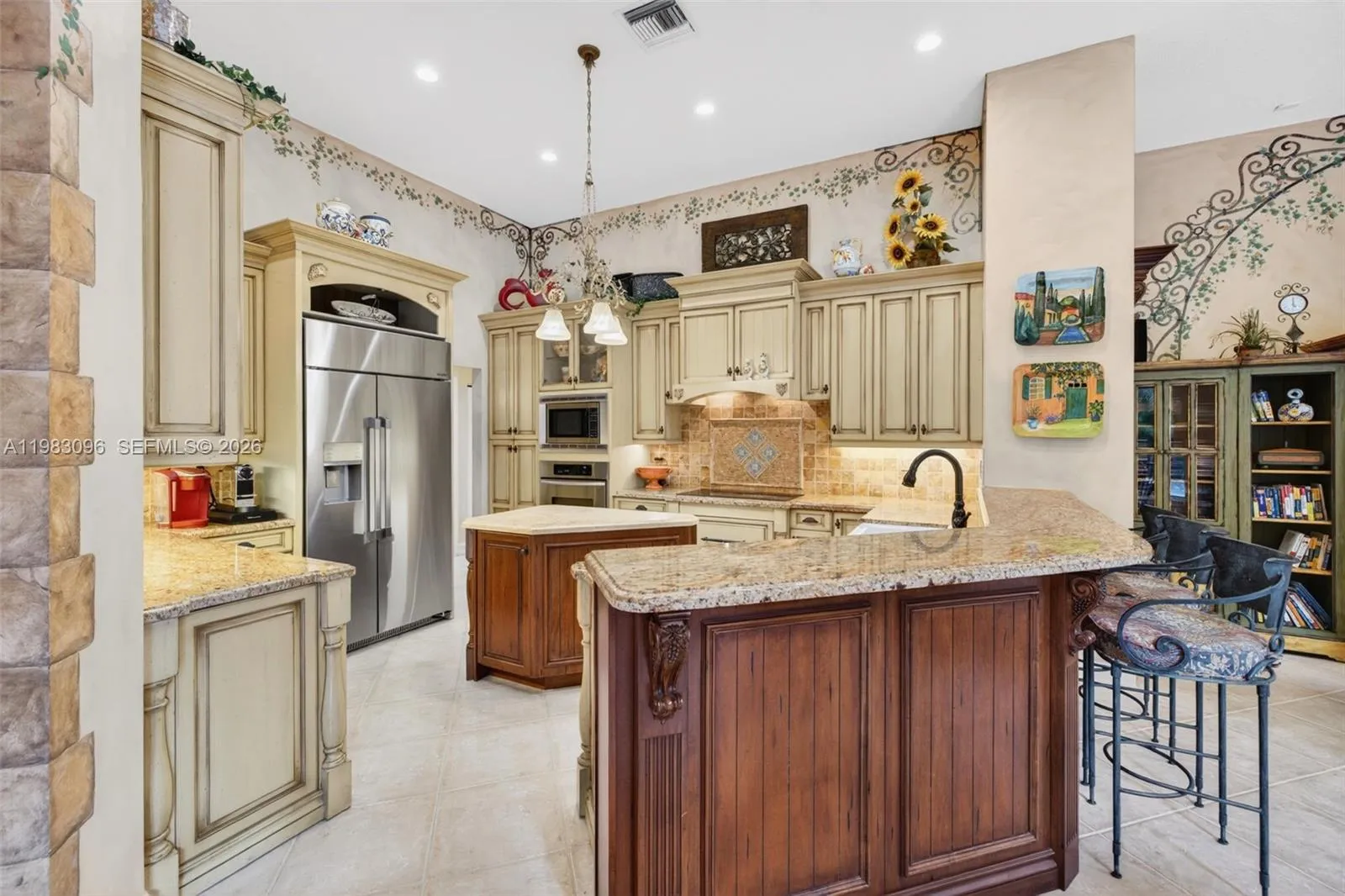 Beautiful handpainted murals and finishes resemble an al fresco restaurant in Europe. Volume Ceilings, Gorgeous painted walls and upgraded wood cabinets, farmhouse sink, high end iron and alabaster fixture in kitchen and another high end fixture over eat in kitchen table. Counter seating and center island in kitchen. Dacor refrigerator, tumbled marble backsplash Beautiful handpainted murals and finishes resemble an al fresco restaurant in Europe. Volume Ceilings, Gorgeous painted walls and upgraded wood cabinets, farmhouse sink, high end iron and alabaster fixture in kitchen and another high end fixture over eat in kitchen table. Counter seating and center island in kitchen. Dacor refrigerator, tumbled marble backsplash
