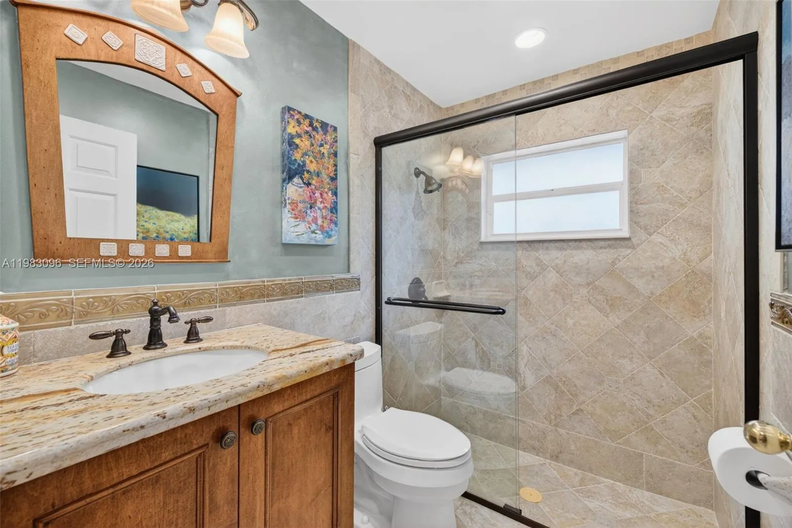 Guest Bathroom is upgraded w/ glass shower door, upgraded vanity and stone counter Guest Bathroom is upgraded w/ glass shower door, upgraded vanity and stone counter