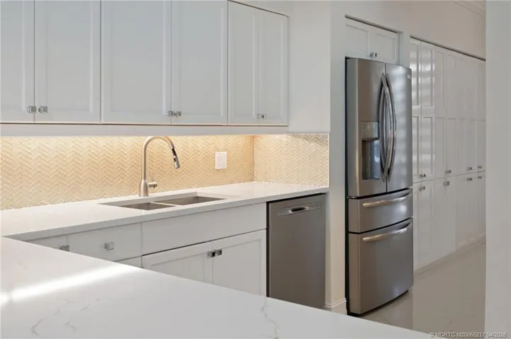 Crisp, white cabinetry, ample counter and cabinet space