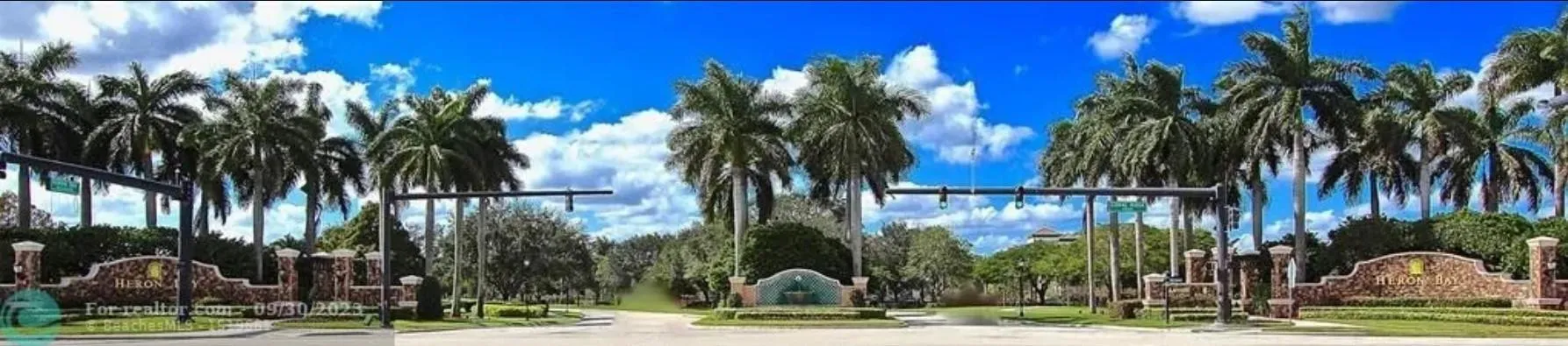 One of the Heron Bay gated entrances with guards 24/7