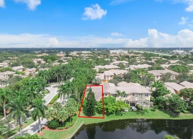Here is the back of the property with lots of garden on the side and a huge Christmas looking tree