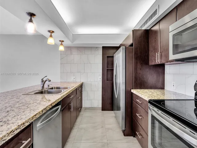 Updated Kitchen with granite counterops and stainless steel appliances