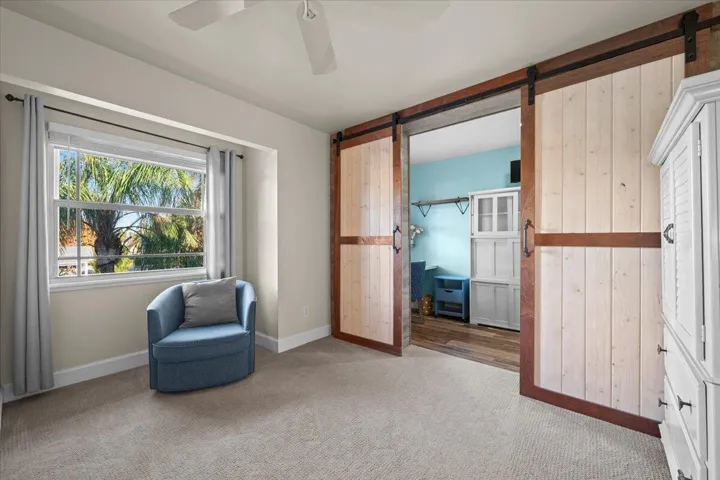 Guest Bedroom with additional space behind Barn Doors