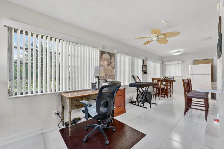Florida room with breakfast bar (2nd refrigerator can stay and be place in garage as a spare)