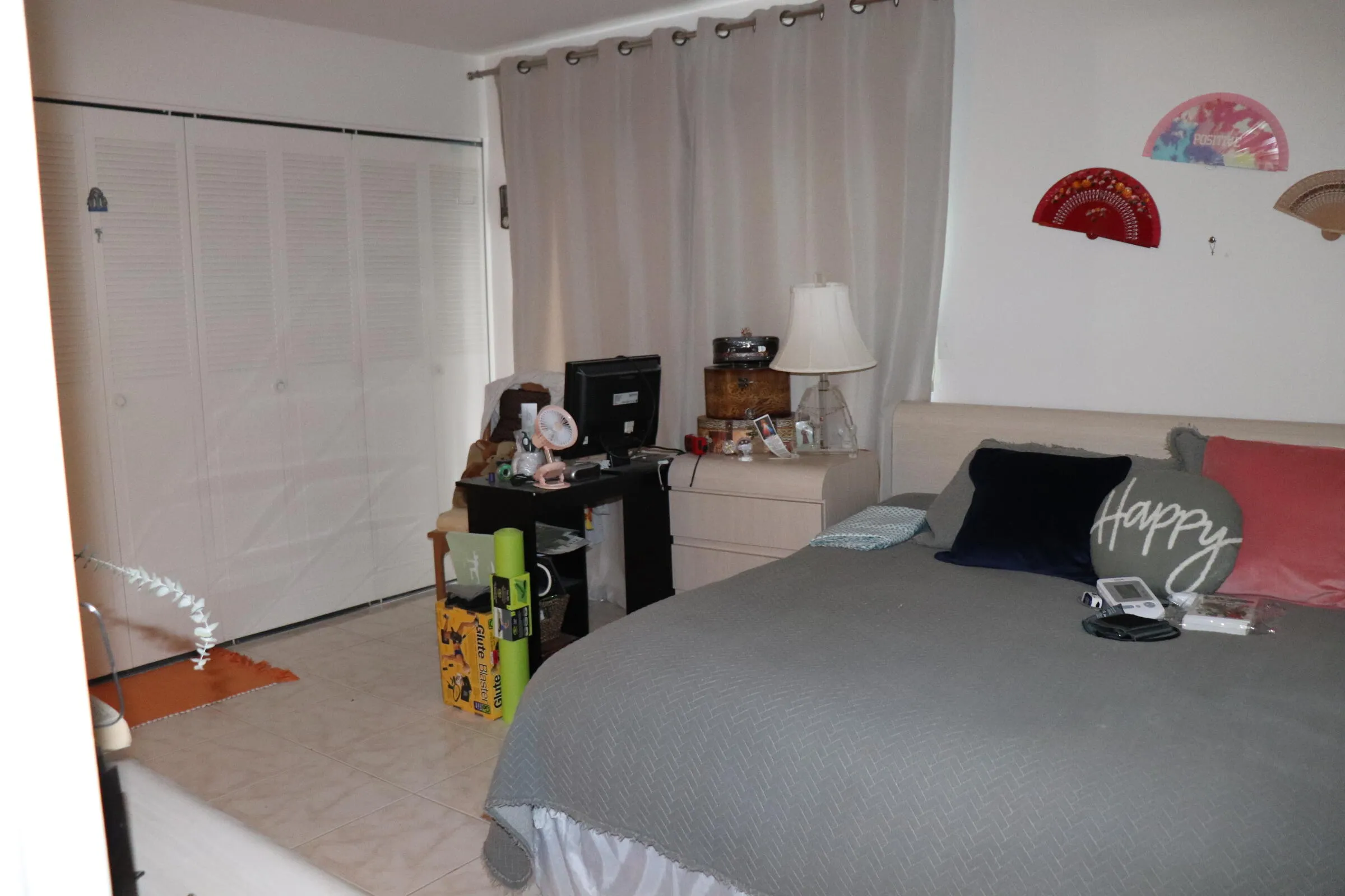 Large bedroom with wall to wall closet space.