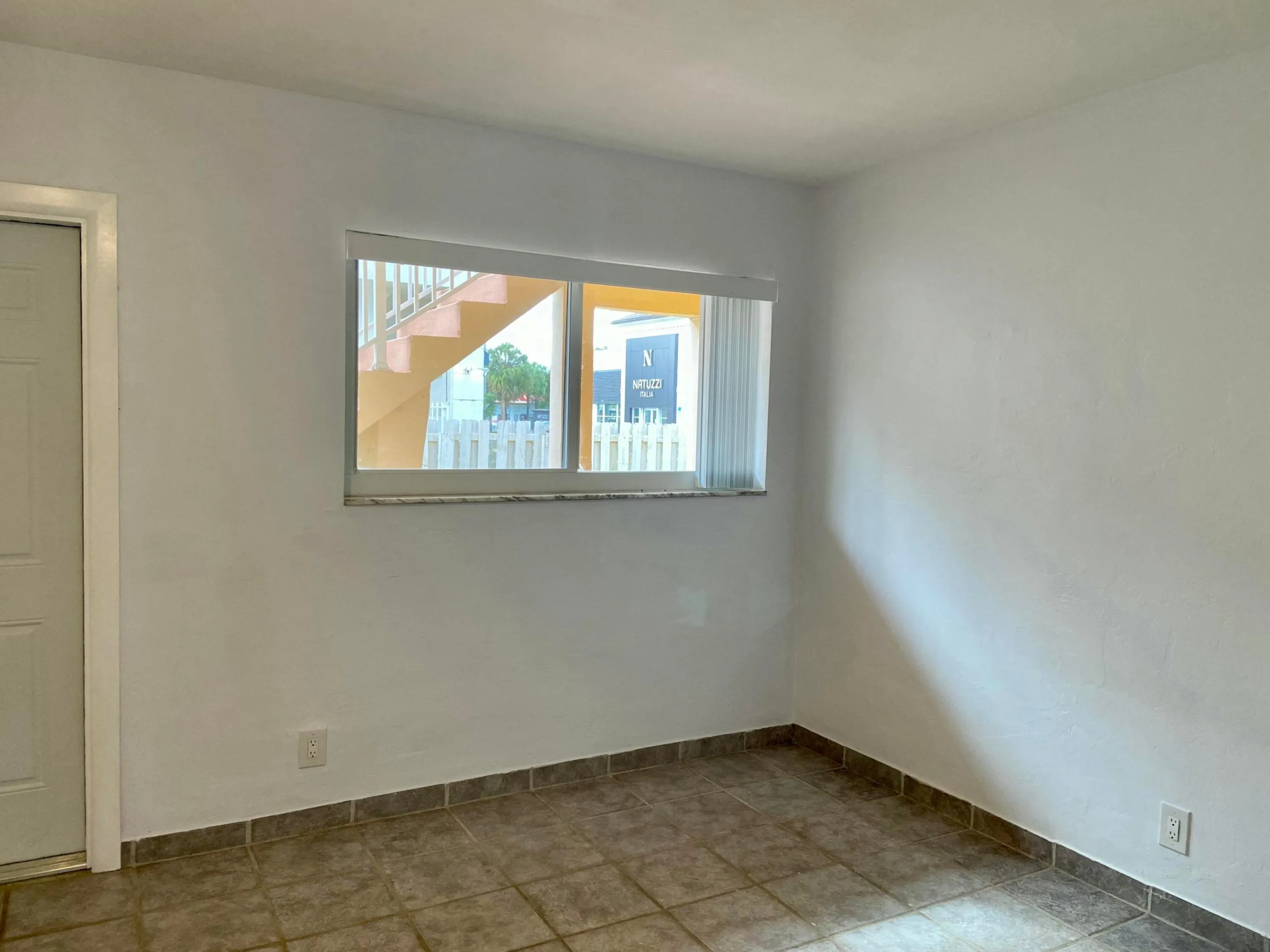 Bedroom with door to Pool, BBQ & Laundry