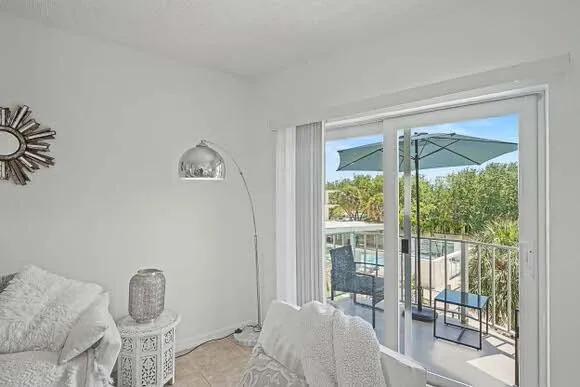 Covered balcony overlooking the pool