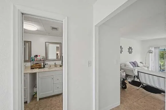 Bathroom to the left of the entrance