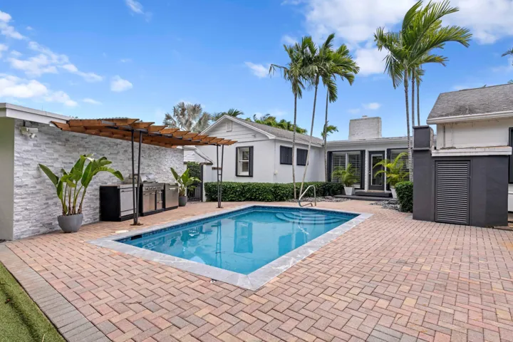 Back patio, pool, and outdoor kitchen.