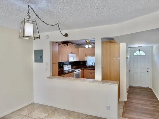 3. dining to kitchen to front door