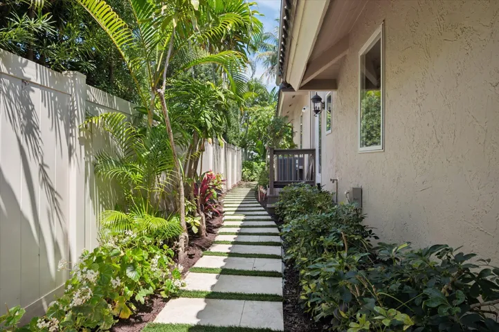 Side pathway connects casita/guest house courtyard to backyard