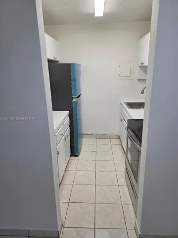 GALLEY KITCHEN AT ENTRANCE OF UNIT