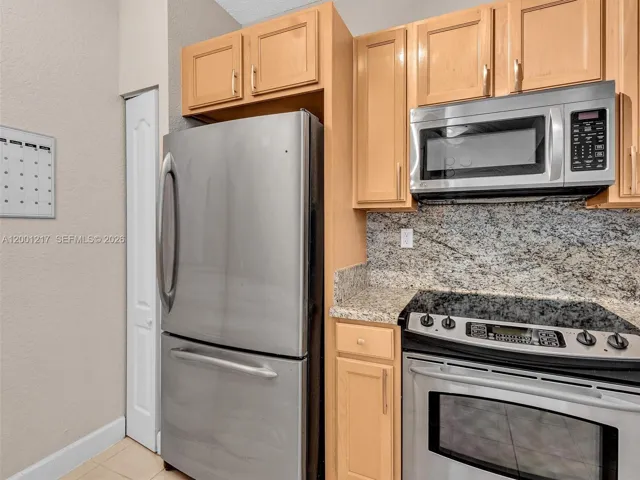 Granite Counters, Wood Cabinets, SS Appliances