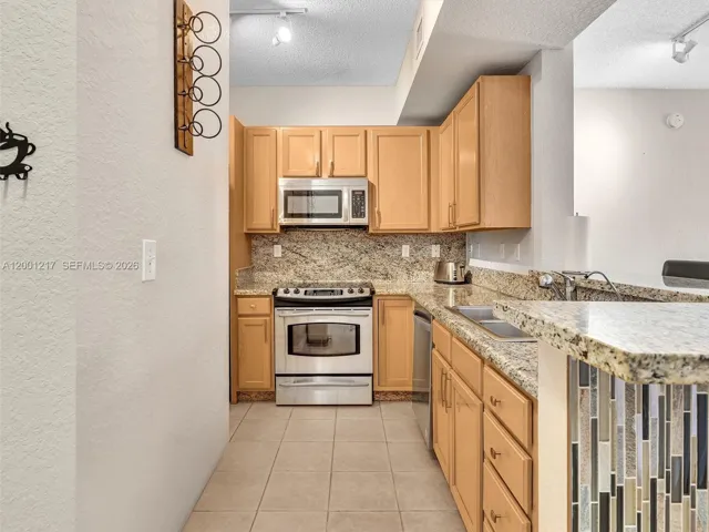 Granite Counters, Wood Cabinets, SS Appliances