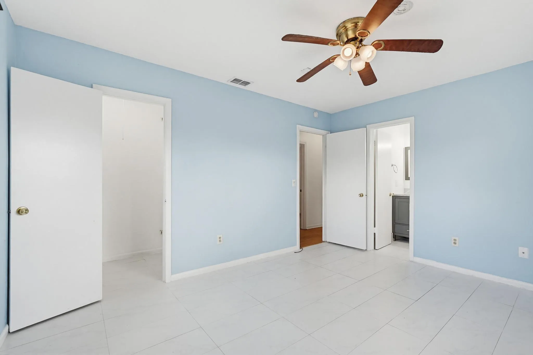 Spacious master bedroom with updated flooring in both the room and master bath.