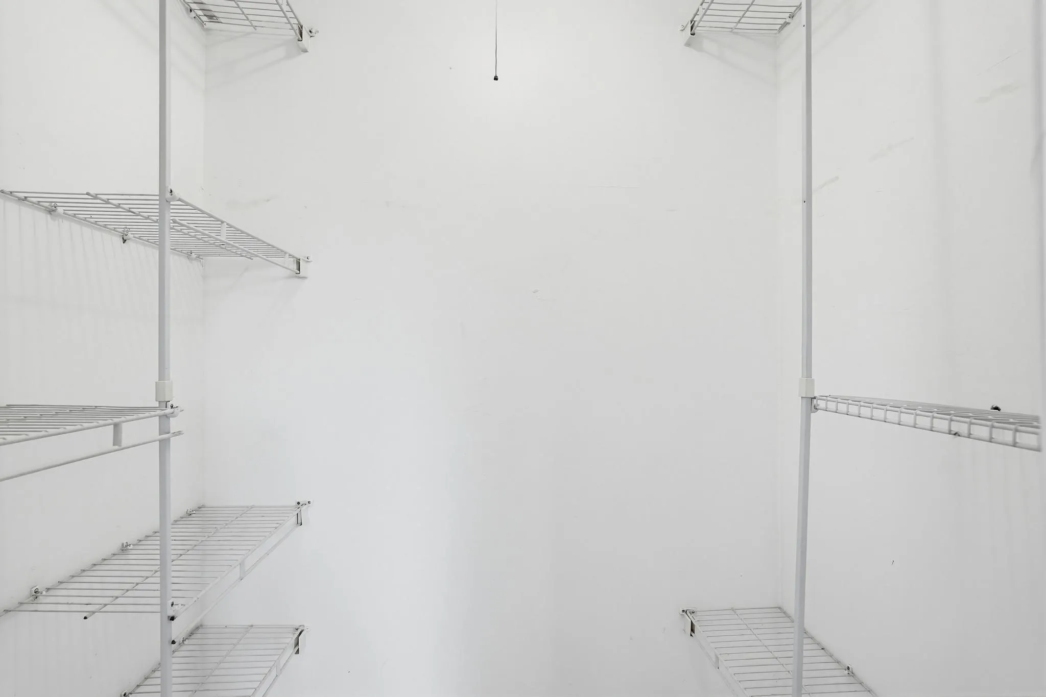Master Suite with closet shelves in walk-in closet