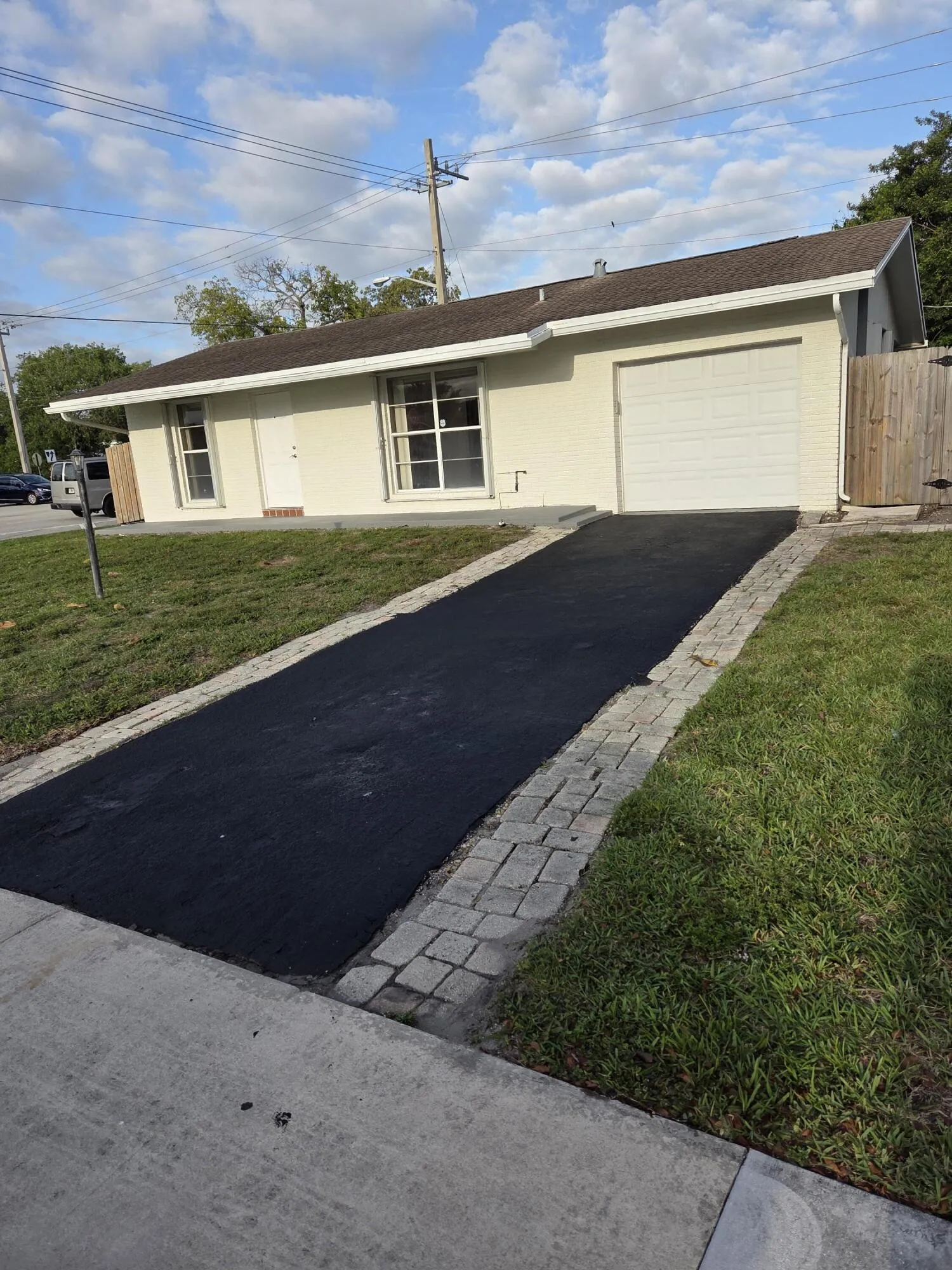 Room for 2 cars plus the one-car garage with updated storm door and opener