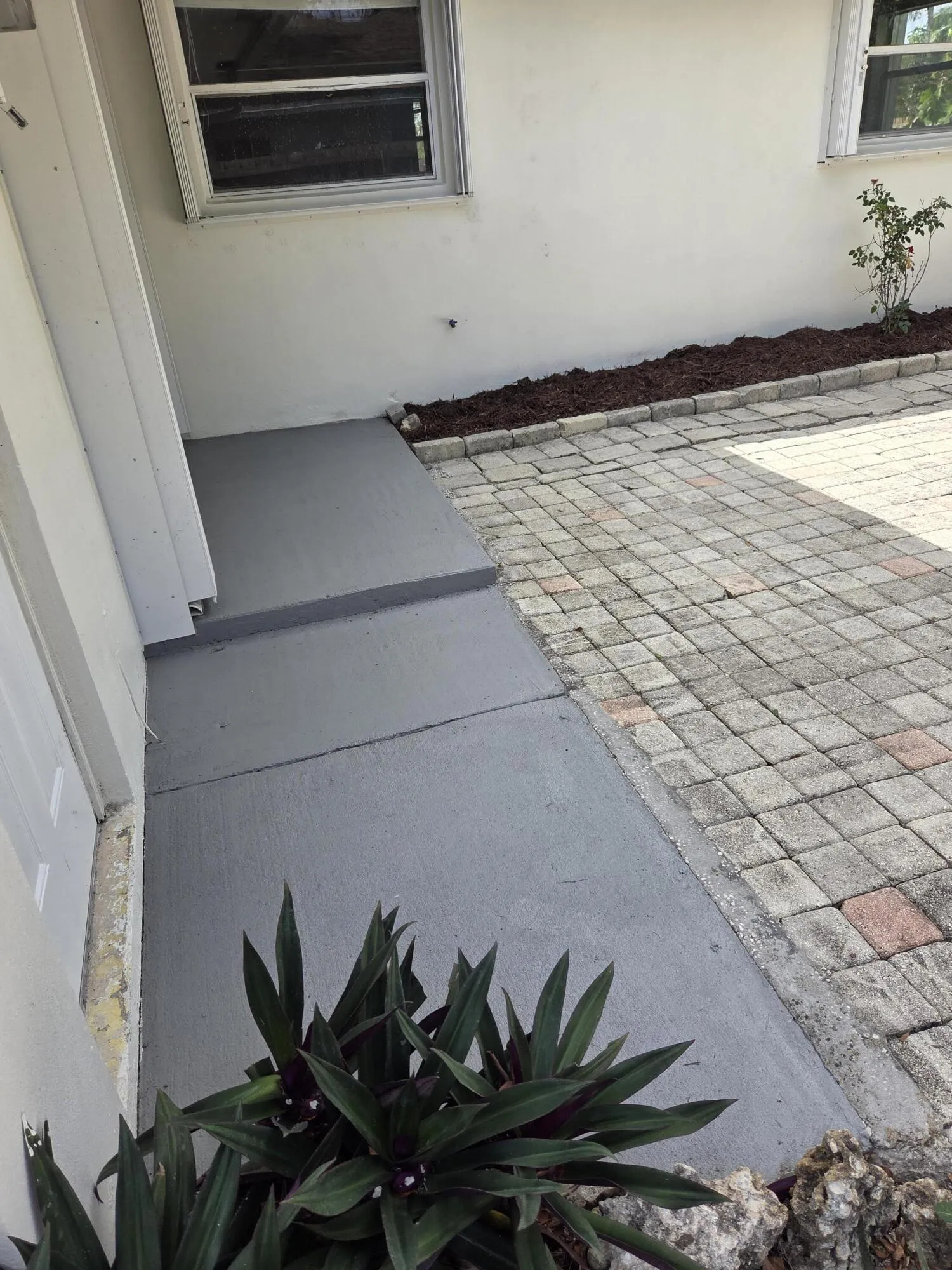 Nice cement patio just painted and larger outdoor brick paver patio